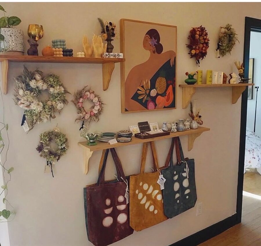 Treat salon — cane chairs, fresh flowers, neon TREAT sign