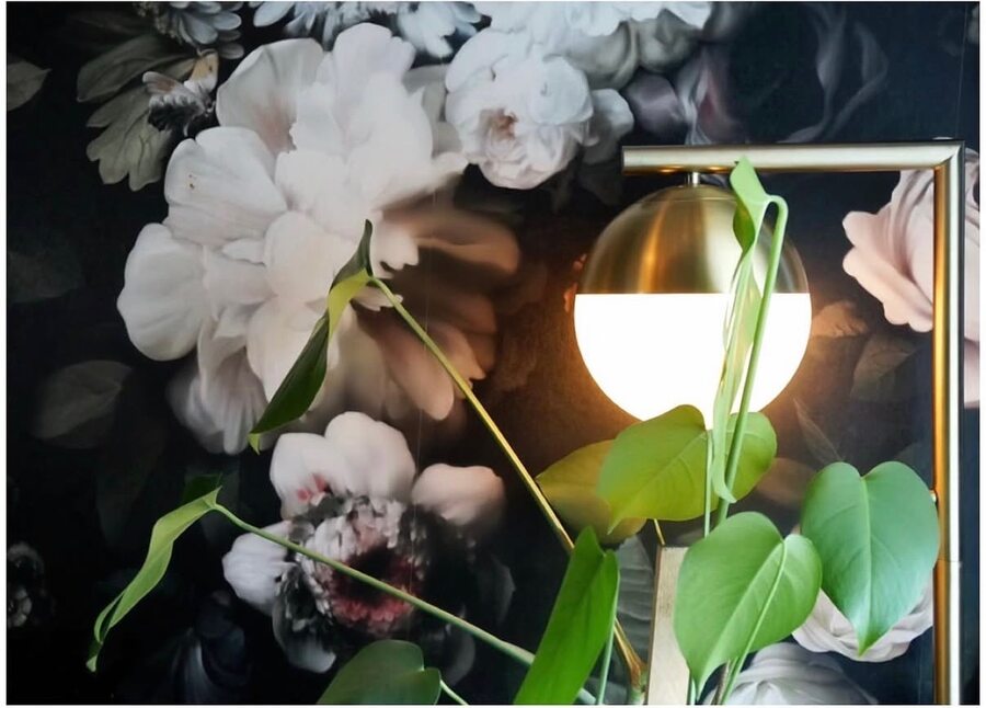 Treat salon wide view — monstera plants and neon sign
