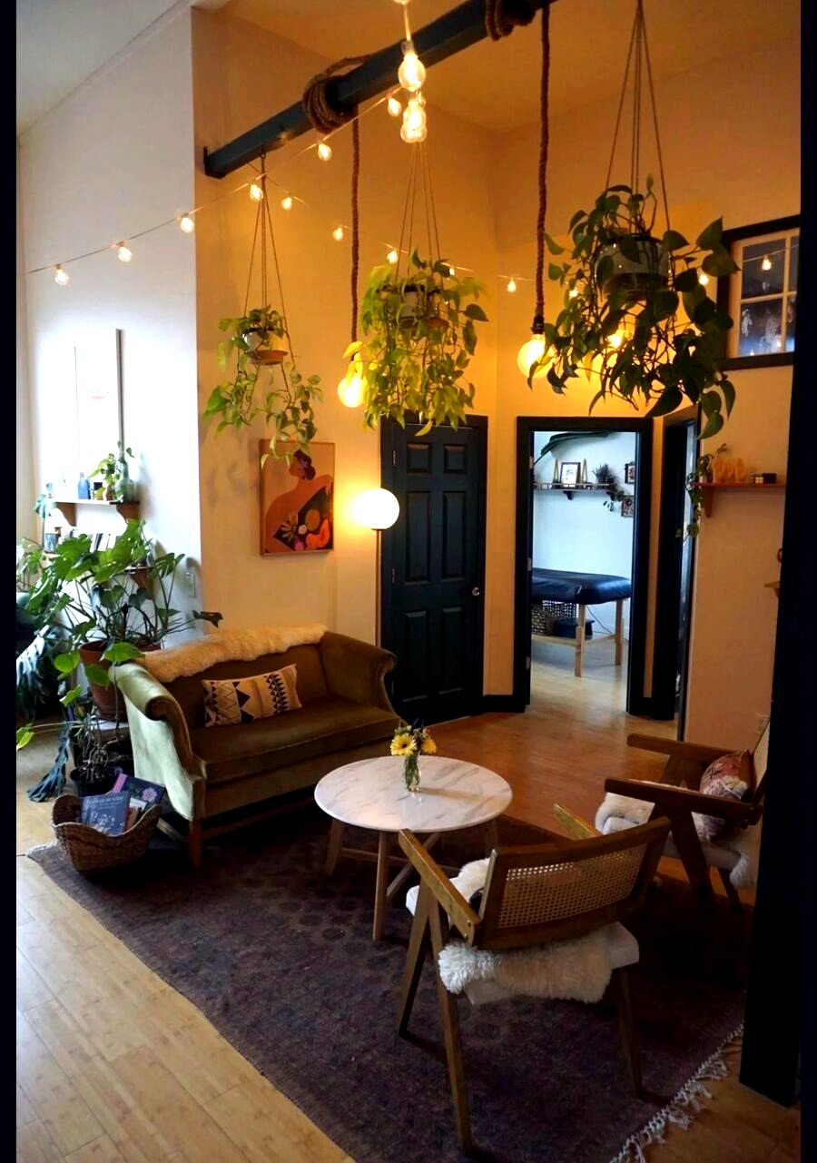 Treat salon interior — string lights and hanging plants